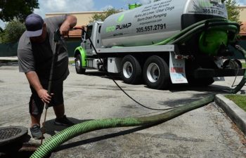 Eco Pump Services technician performing grease trap cleaning